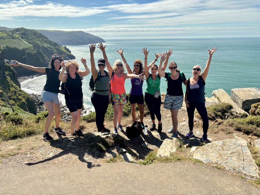 Reboot-25-group-valley-rocks-arms-up-900x675